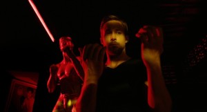 The whole film uses colors (especially red) stunningly. This one just one of many examples. More importantly though, it focuses on Gosling's hands, a symbol for his guilt throughout. 