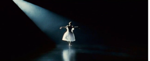 The shot highlight's Portman's innocence (the exaggerated white surrounded by darkness)